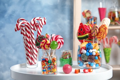 Composition with many different candies on table