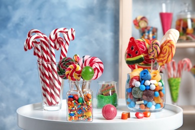 Photo of Composition with many different candies on table