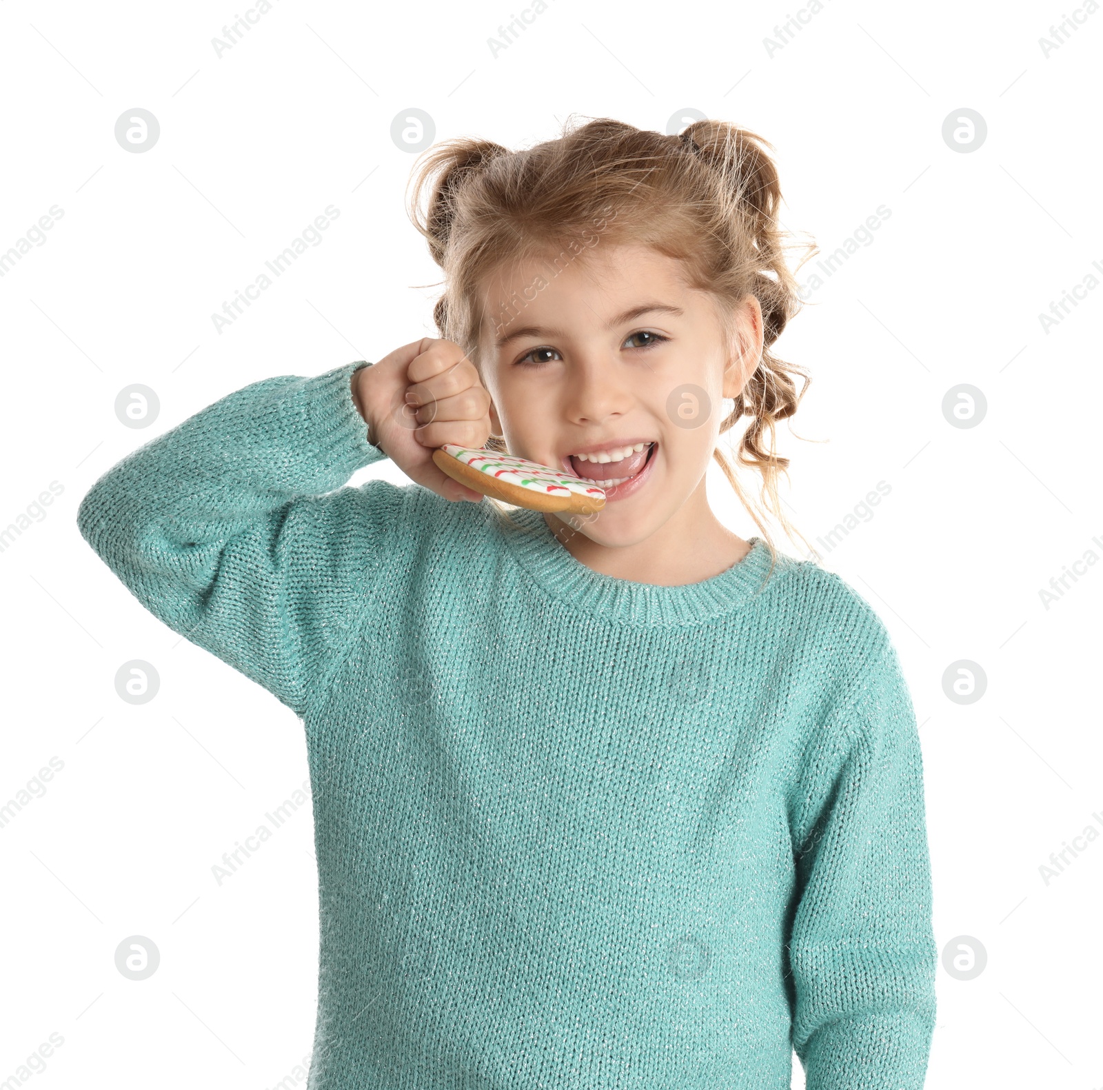 Photo of Cute little girl with Christmas gingerbread cookie on white background