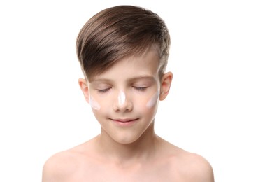 Boy with sun protection cream on his face against white background