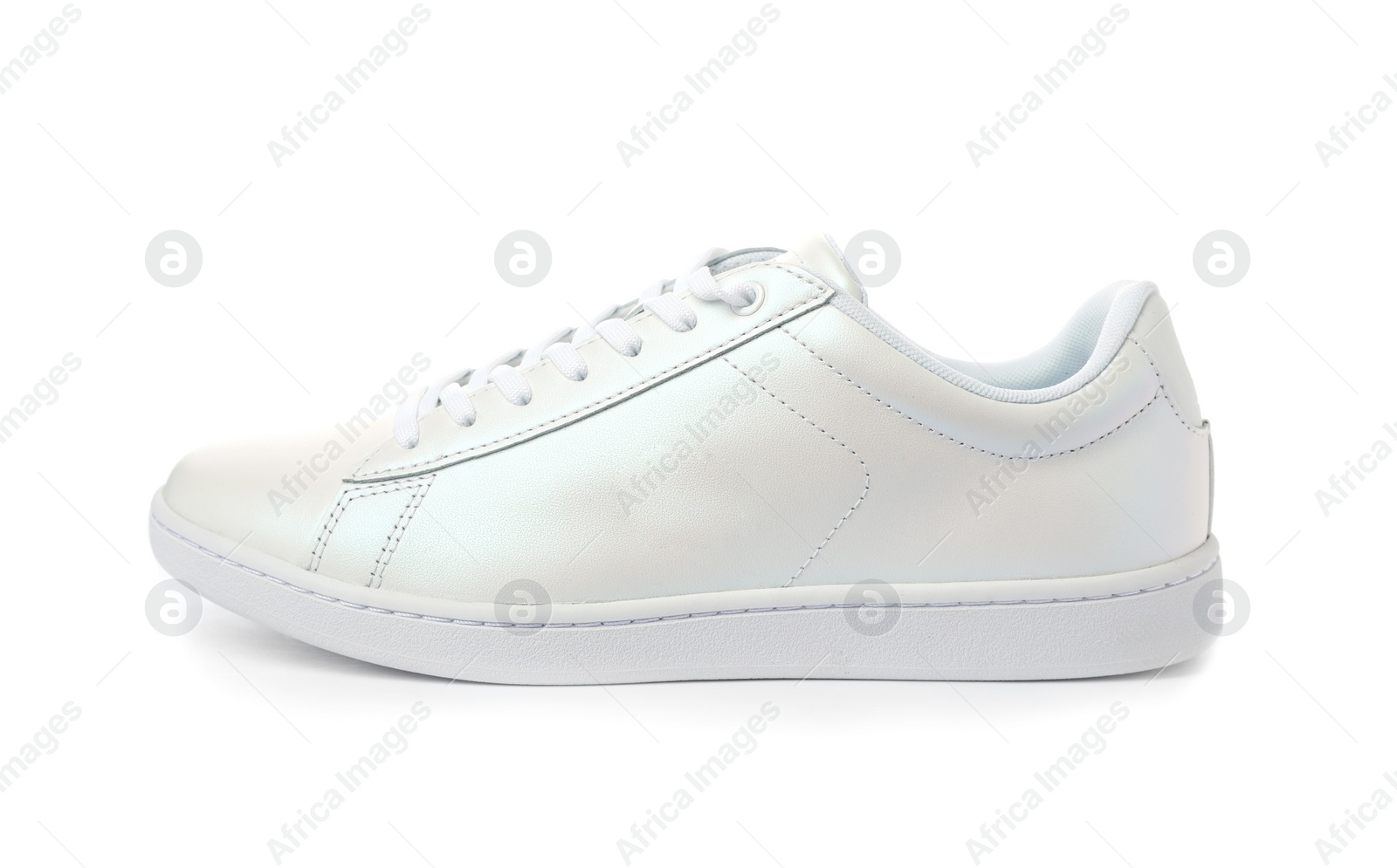 Photo of Clean new trendy sneaker on white background