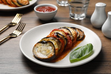 Photo of Delicious ratatouille served on wooden table, closeup