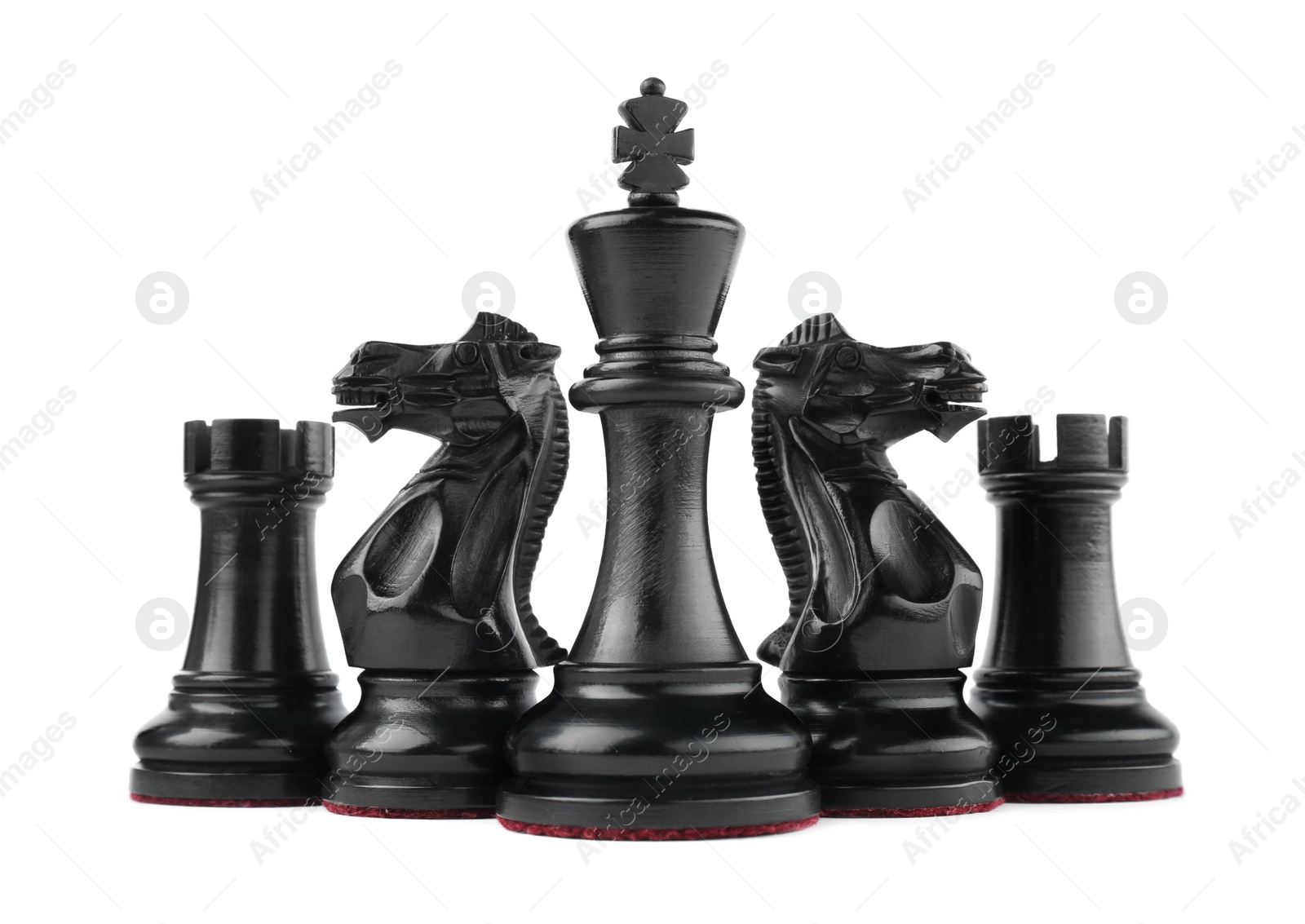 Photo of Set of black chess pieces on white background