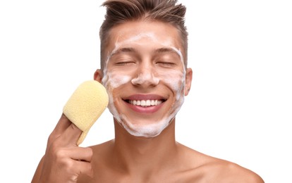 Photo of Happy young man washing his face with sponge on white background