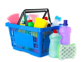 Shopping basket full of detergents on white background