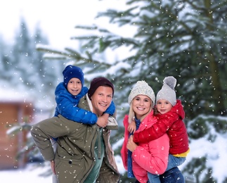 Image of Happy family spending time together at winter resort