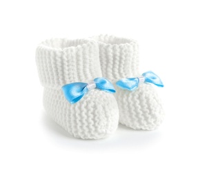Photo of Handmade baby booties with bows isolated on white