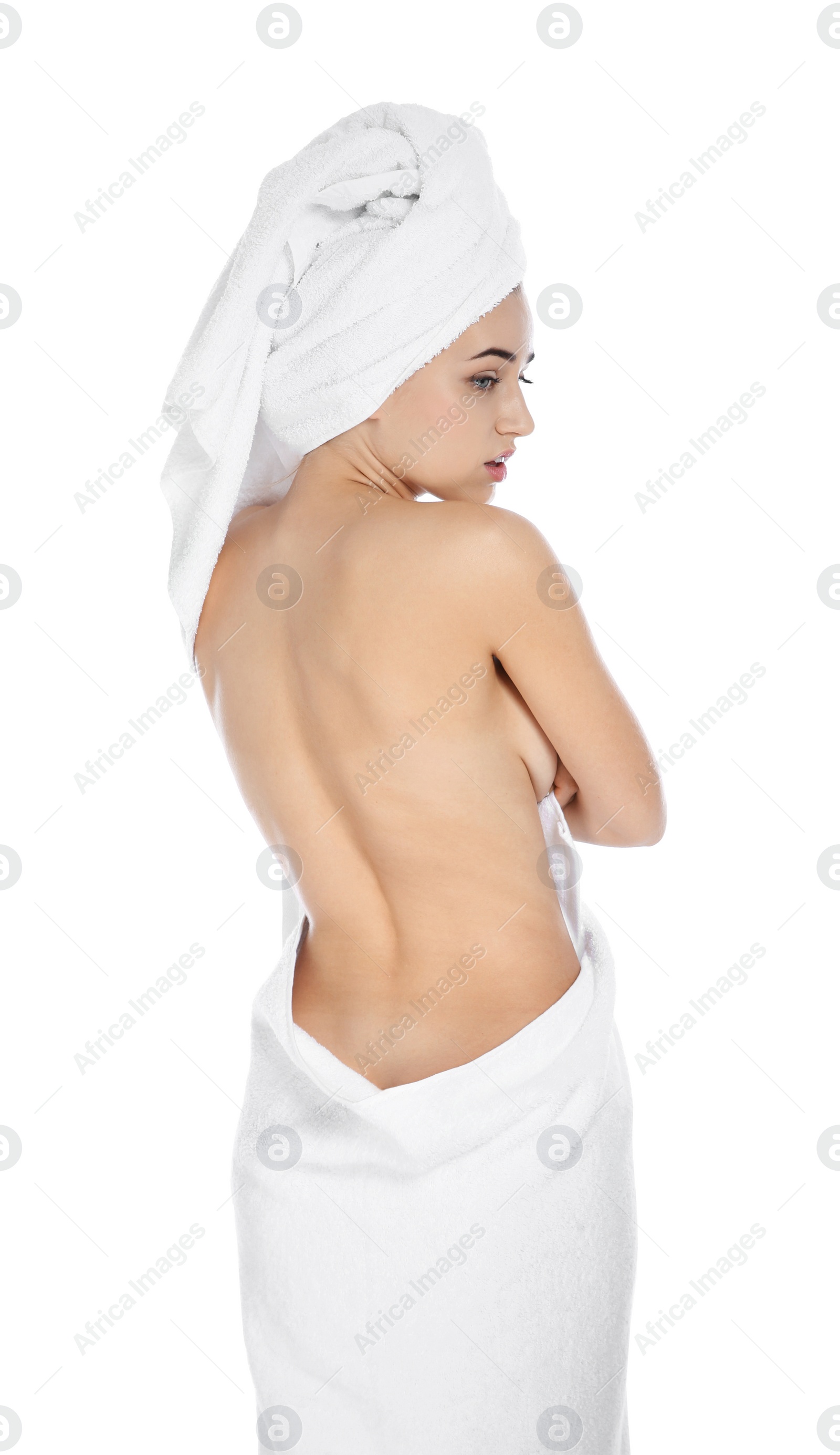 Photo of Young woman with soft towels on white background