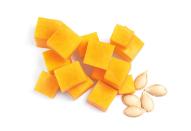 Photo of Pieces of ripe orange pumpkin and seeds on white background, top view