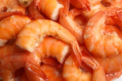 Photo of Pile of delicious cooked shrimps as background, closeup