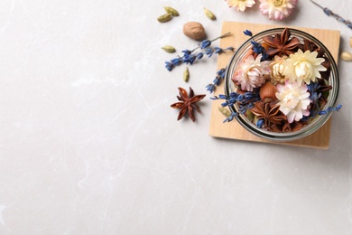 Photo of Aroma potpourri with different spices on white table, flat lay. Space for text