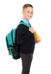 Photo of Portrait of cute boy in school uniform on white background