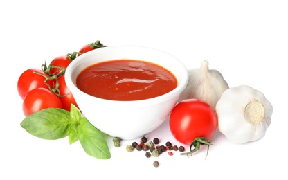 Photo of Composition with bowl of tomato sauce and vegetables isolated on white