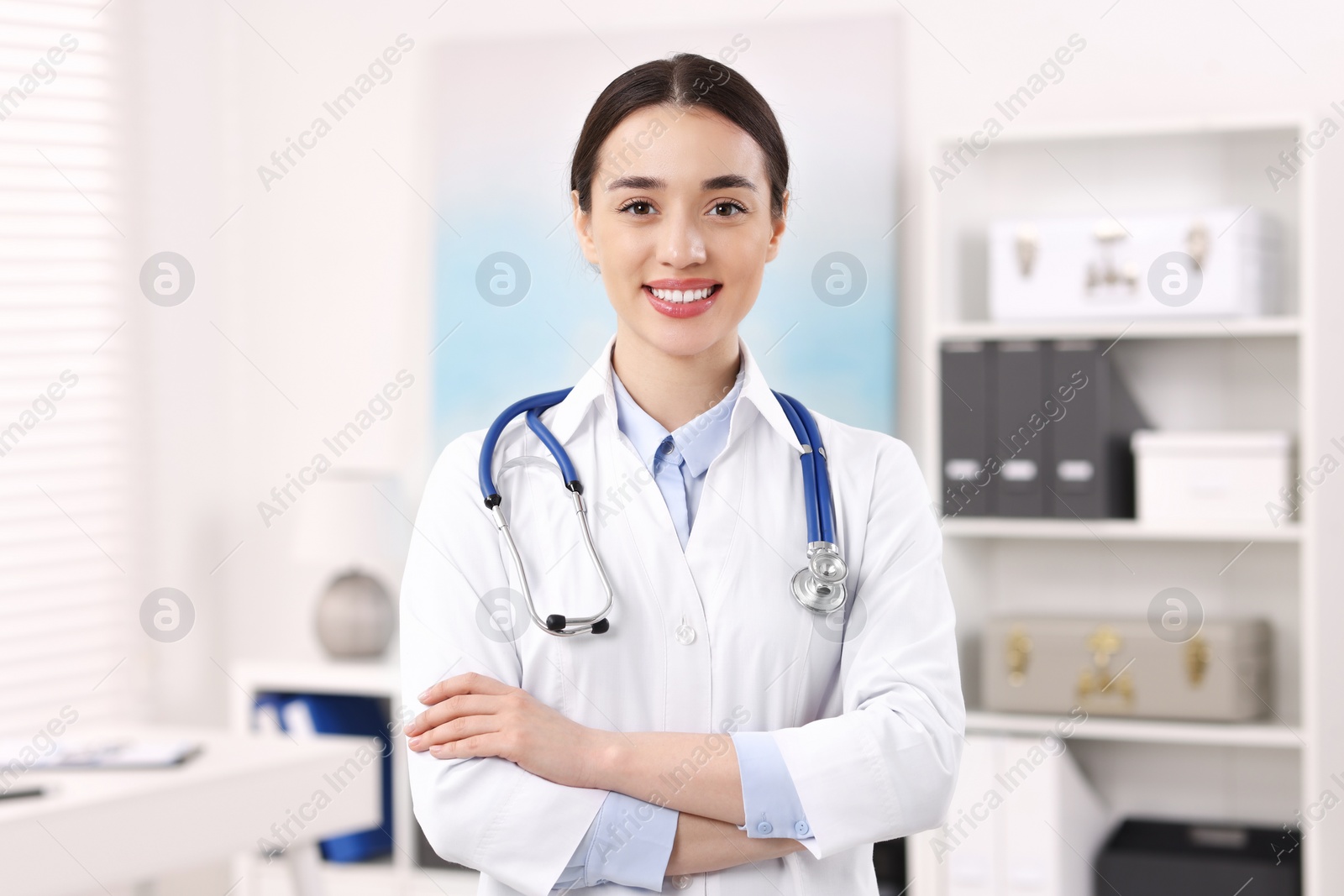 Photo of Portrait of medical consultant with stethoscope in clinic