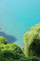 Photo of Picturesque view of green hills and sea with boat