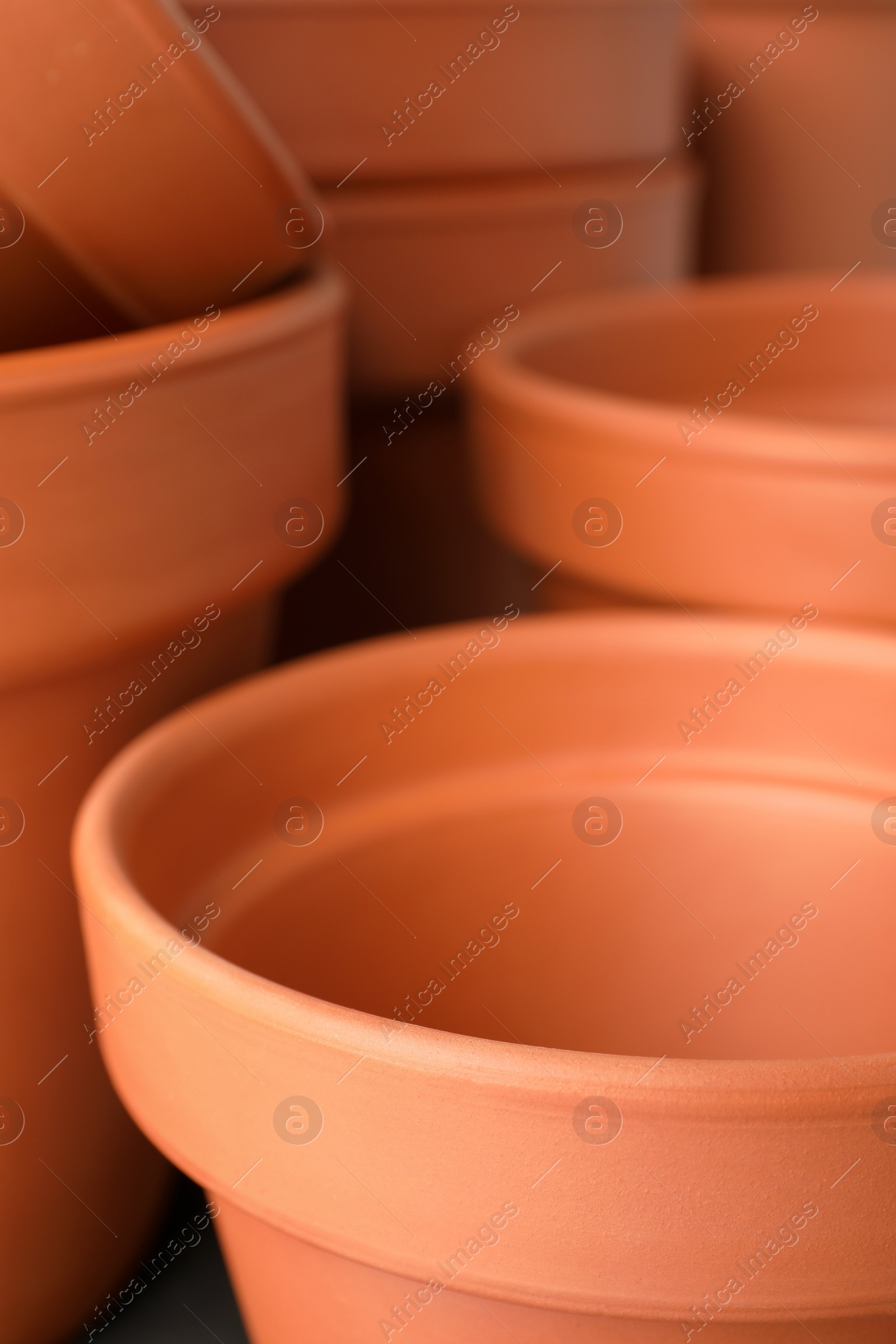 Photo of Many clay flower pots as background, closeup