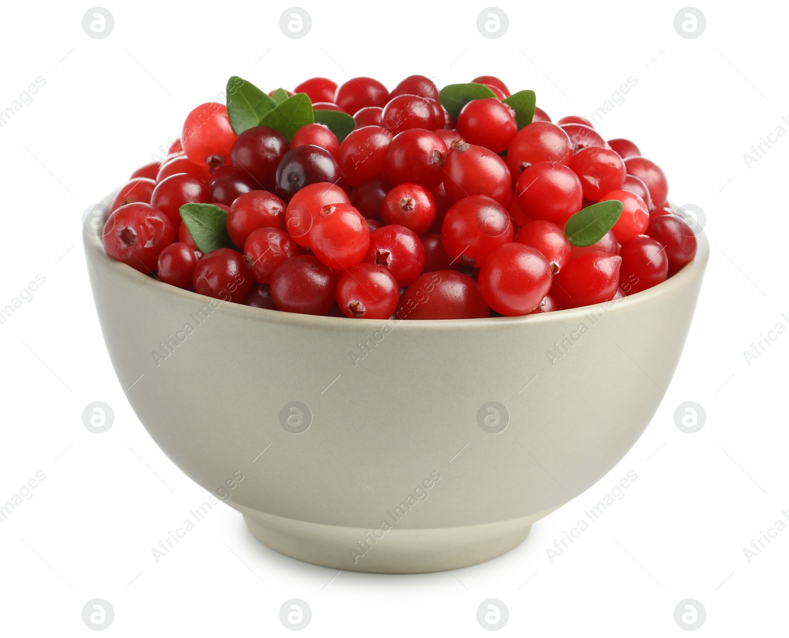 Photo of Bowl of fresh ripe cranberries with leaves isolated on white