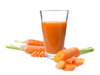 Carrots and glass of fresh juice on white background