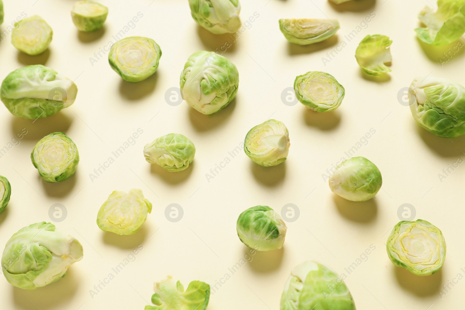 Photo of Fresh Brussels sprouts on color background. Organic vegetables