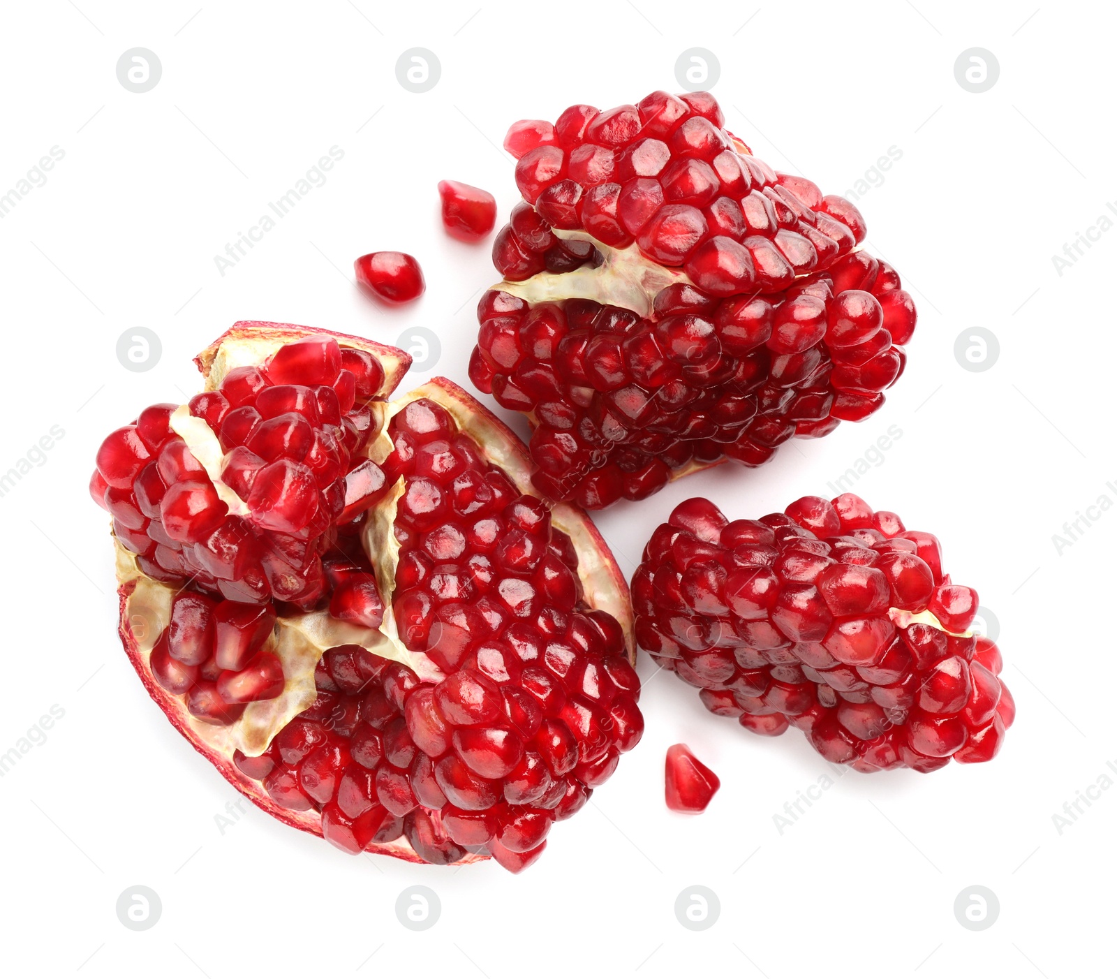 Photo of Fresh cut pomegranate isolated on white, top view