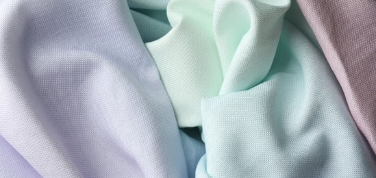 Photo of Different crumpled fabrics as background, top view