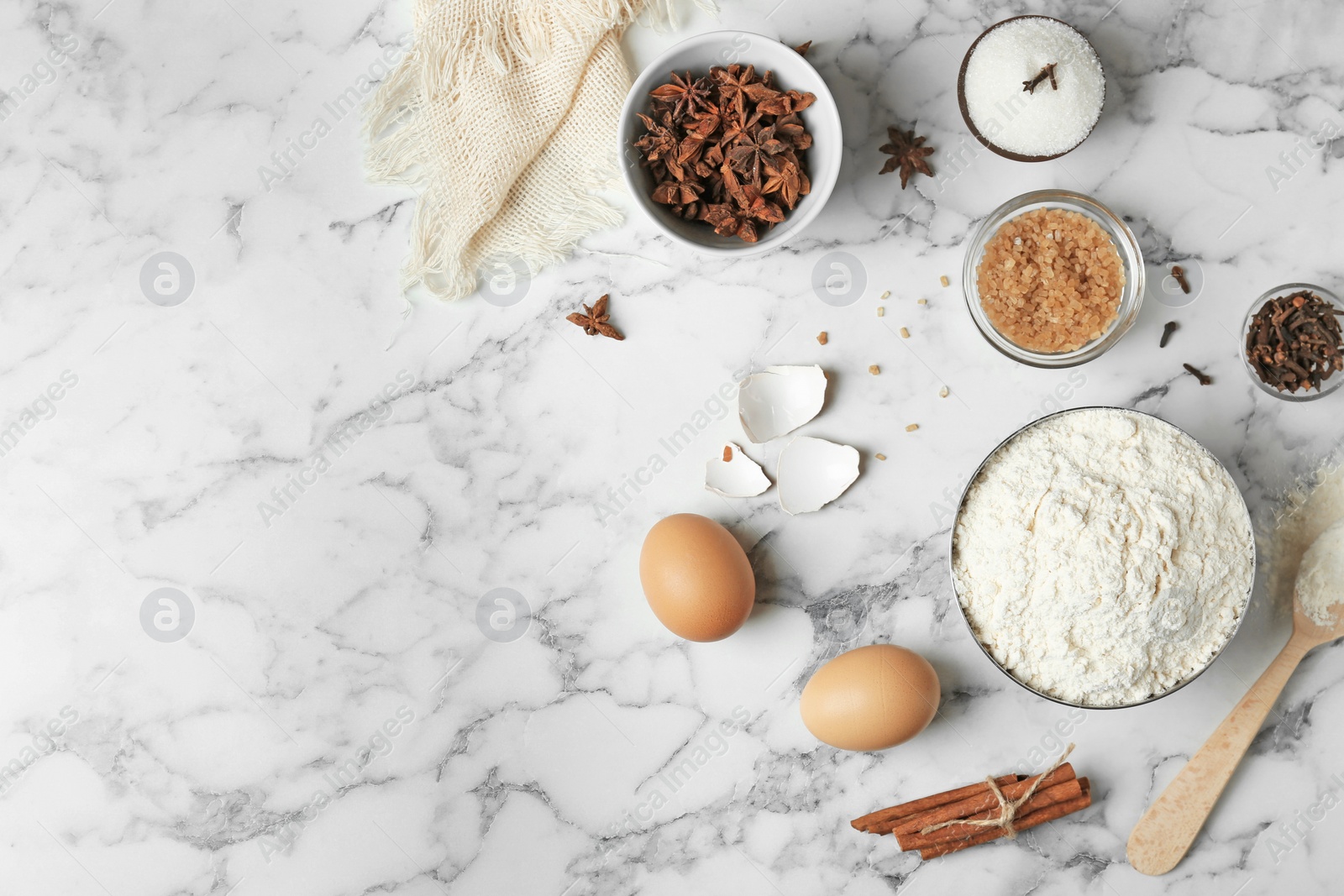 Photo of Composition with flour, eggs and sugar on light grey background, top view