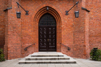 Entrance of building with beautiful arched wooden door