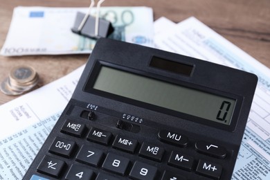 Photo of Tax accounting. Calculator, document and money on table, closeup