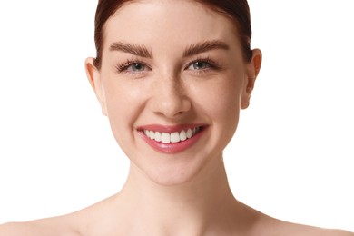 Portrait of smiling woman on white background, closeup
