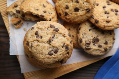 Photo of Delicious chocolate chip cookies on table, flat lay