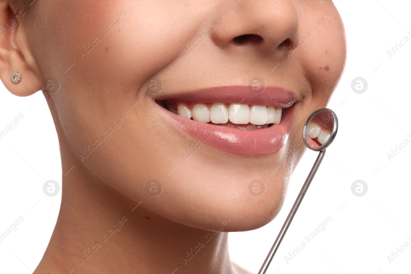 Photo of Young woman with mouth mirror on white background, closeup. Cosmetic dentistry