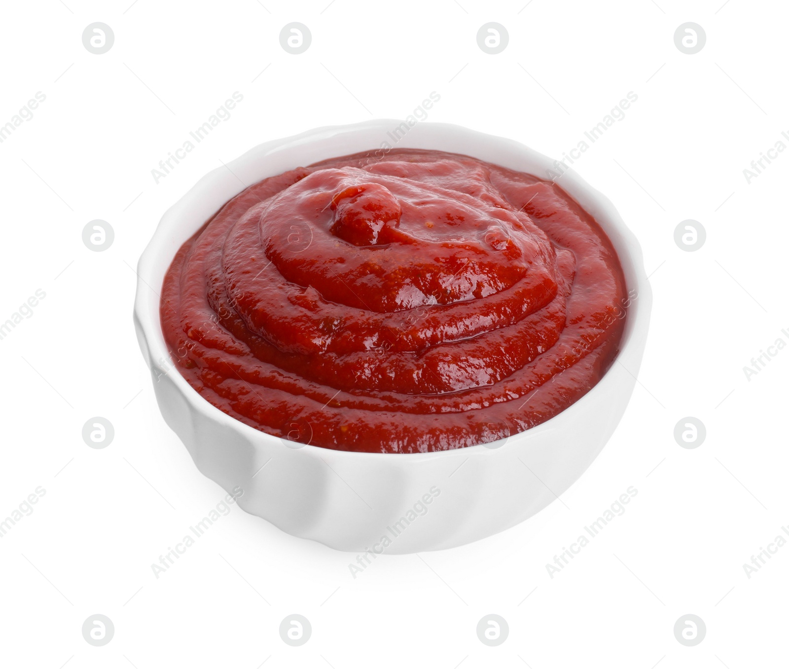 Photo of Tasty ketchup in bowl isolated on white. Tomato sauce