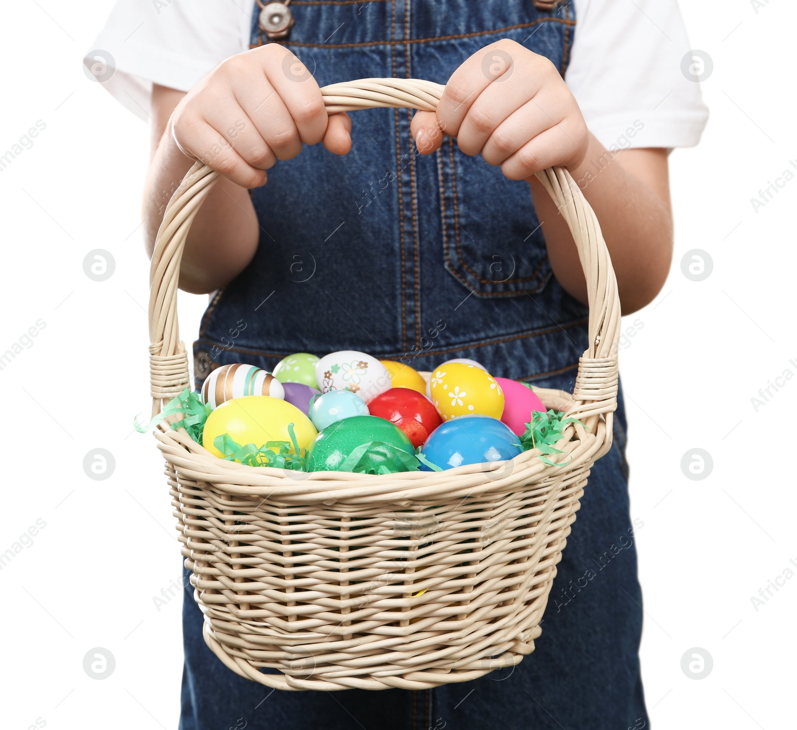 Photo of Little girl with basket full of Easter eggs on white background, closeup