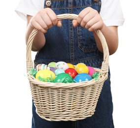 Photo of Little girl with basket full of Easter eggs on white background, closeup