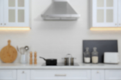 Blurred view of modern kitchen with stove