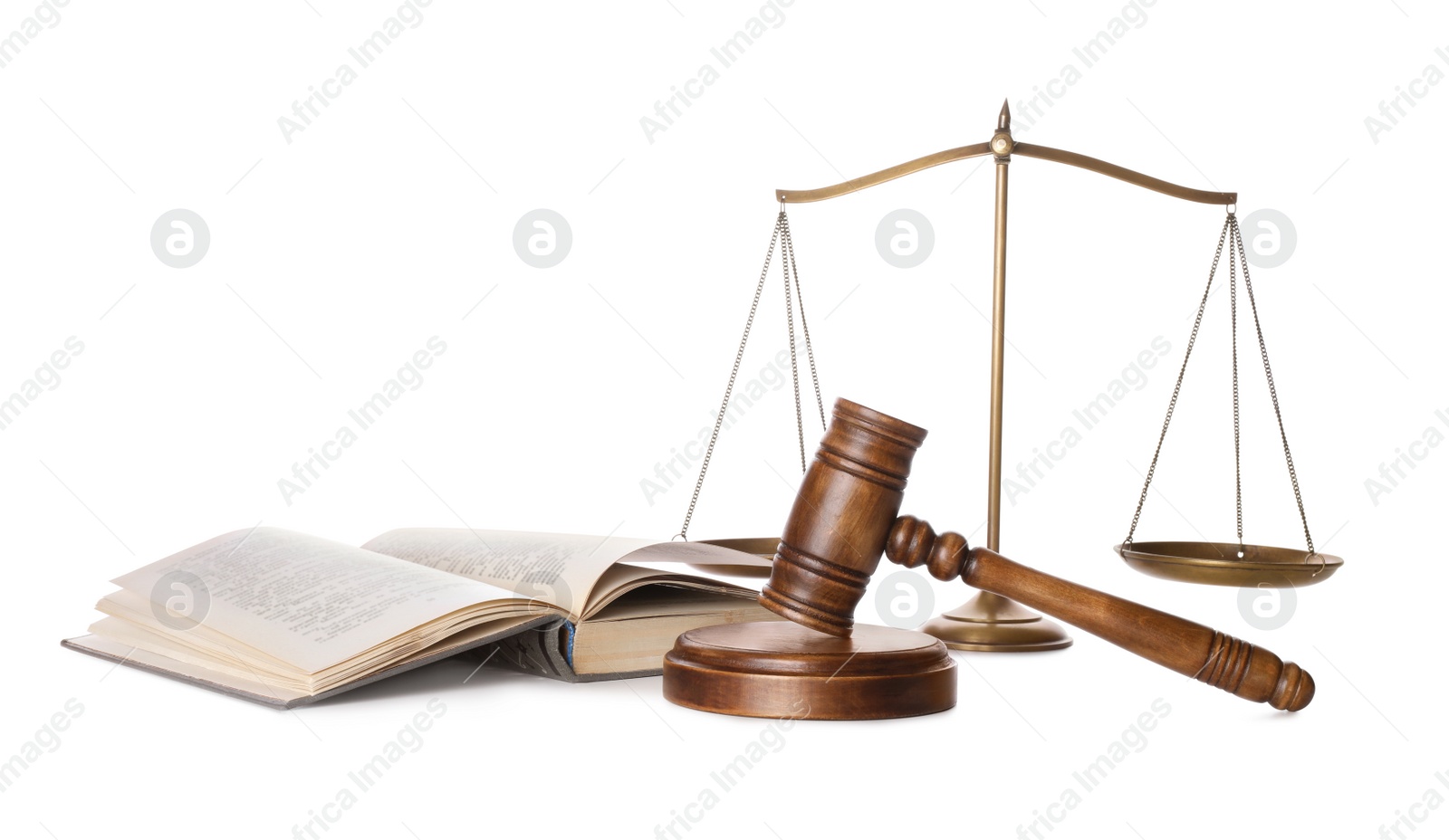 Photo of Wooden gavel, book and scales of justice on white background