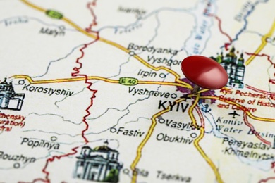 MYKOLAIV, UKRAINE - NOVEMBER 09, 2020: Kyiv city marked with push pin on map of Ukraine, closeup