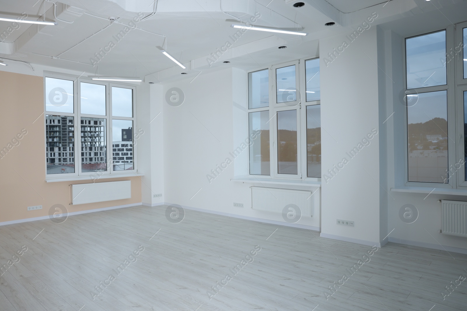 Photo of New empty room with clean windows and light walls