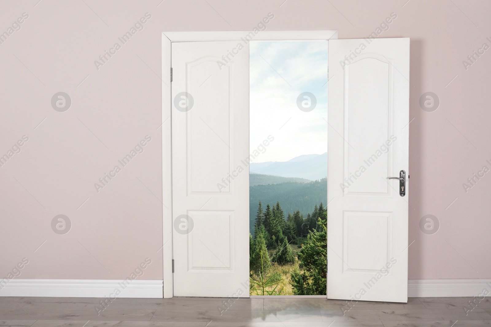 Image of Beautiful mountain landscape visible through open door