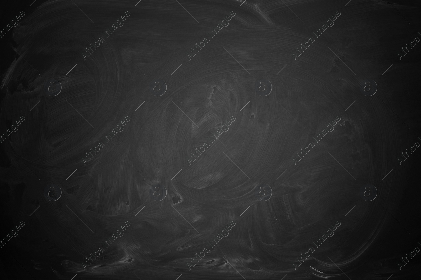 Image of Dirty black chalkboard as background. Vignette effect