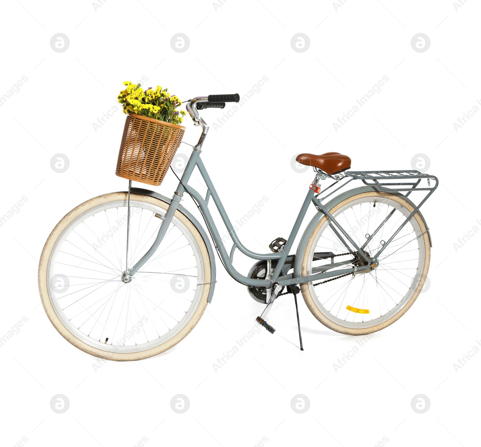 Photo of Retro bicycle with wicker basket on white background