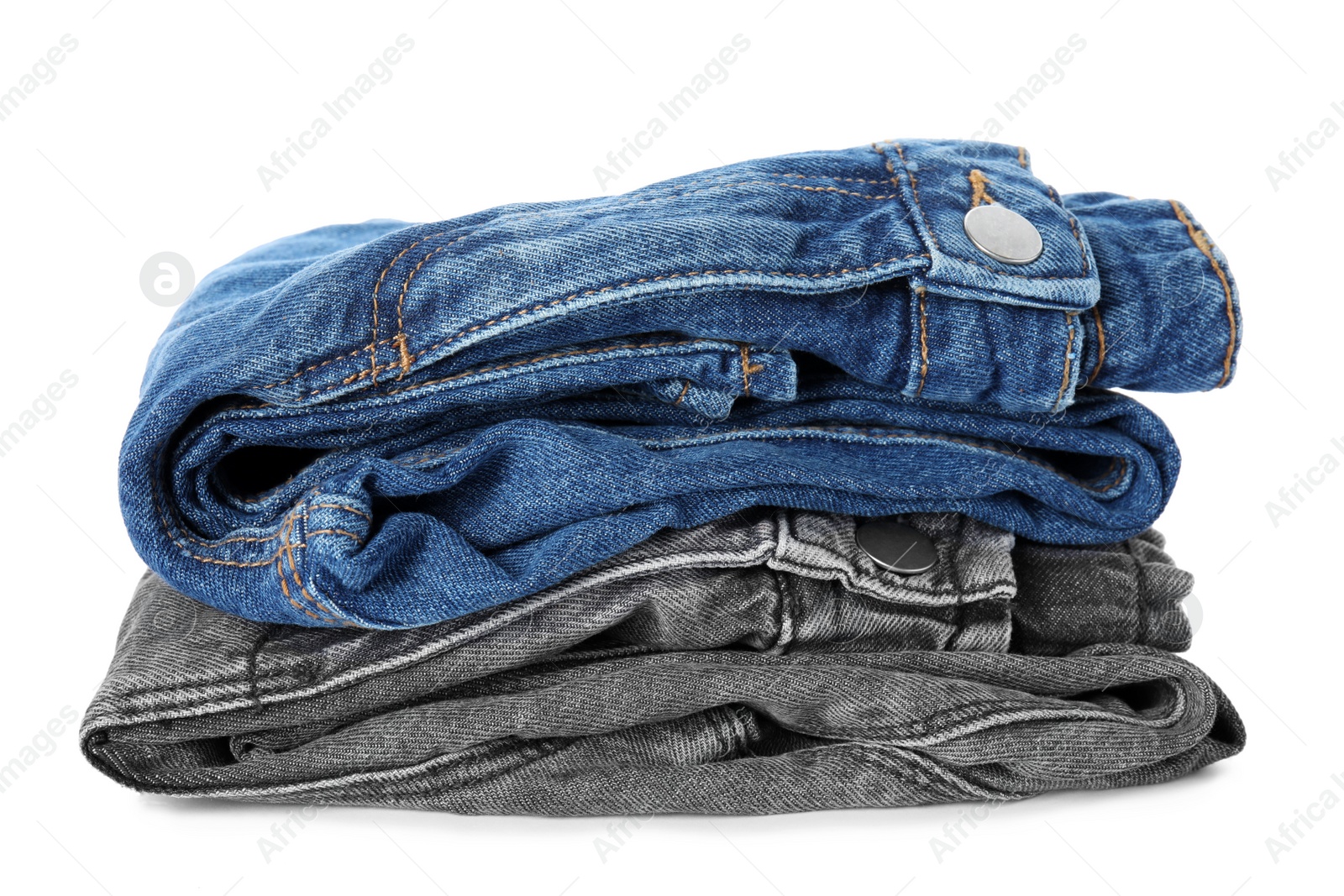 Photo of Stack of folded jeans on white background