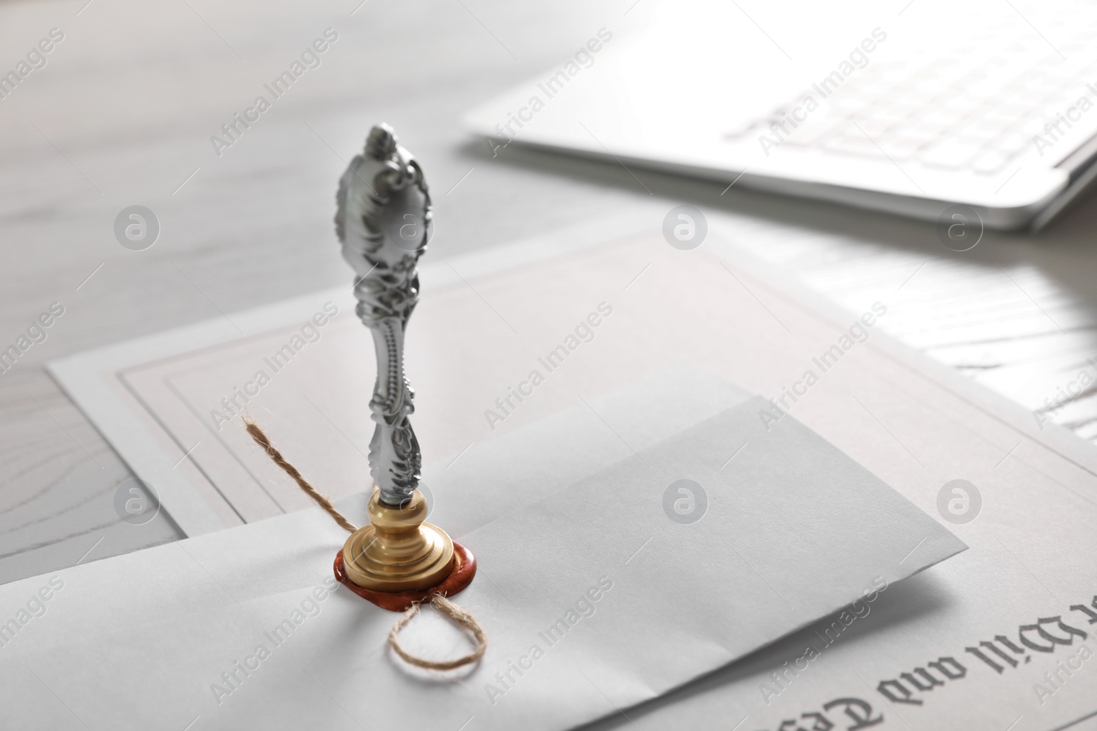 Photo of Vintage notary stamp and documents on desk, closeup