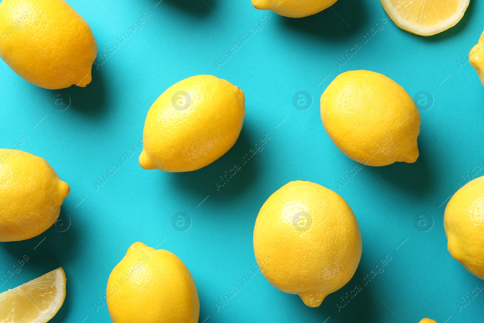 Photo of Flat lay composition with lemons on color background