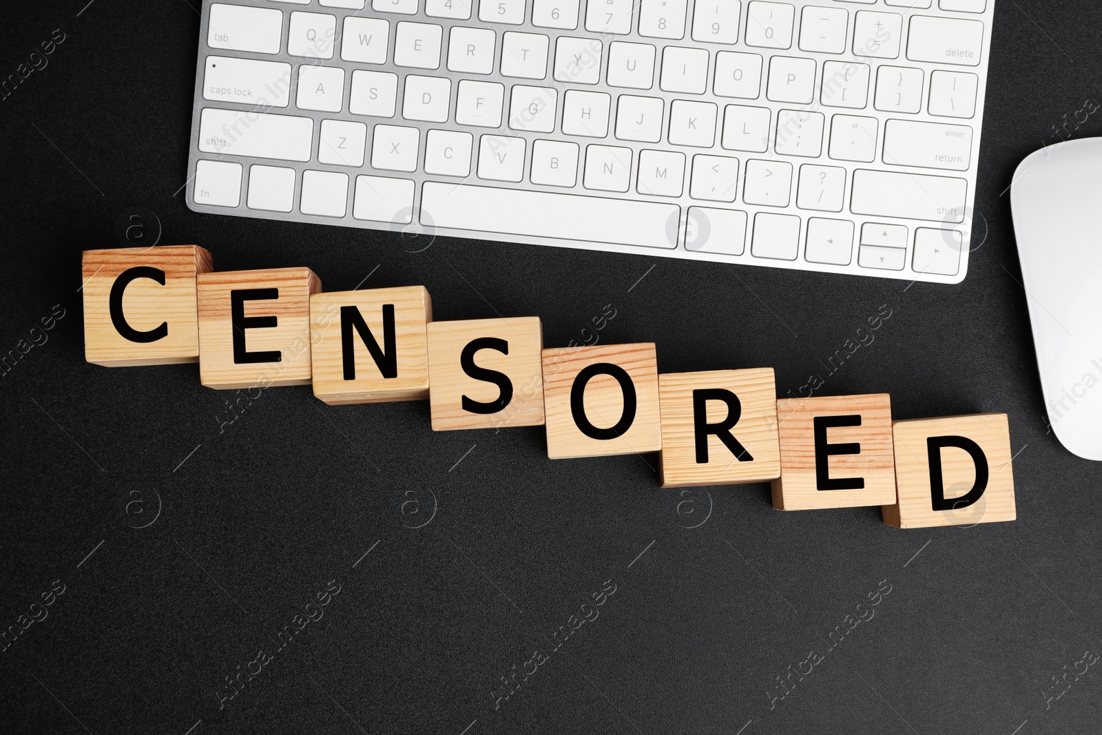 Photo of Wooden cubes with word Censored, keyboard and computer mouse on black background, flat lay