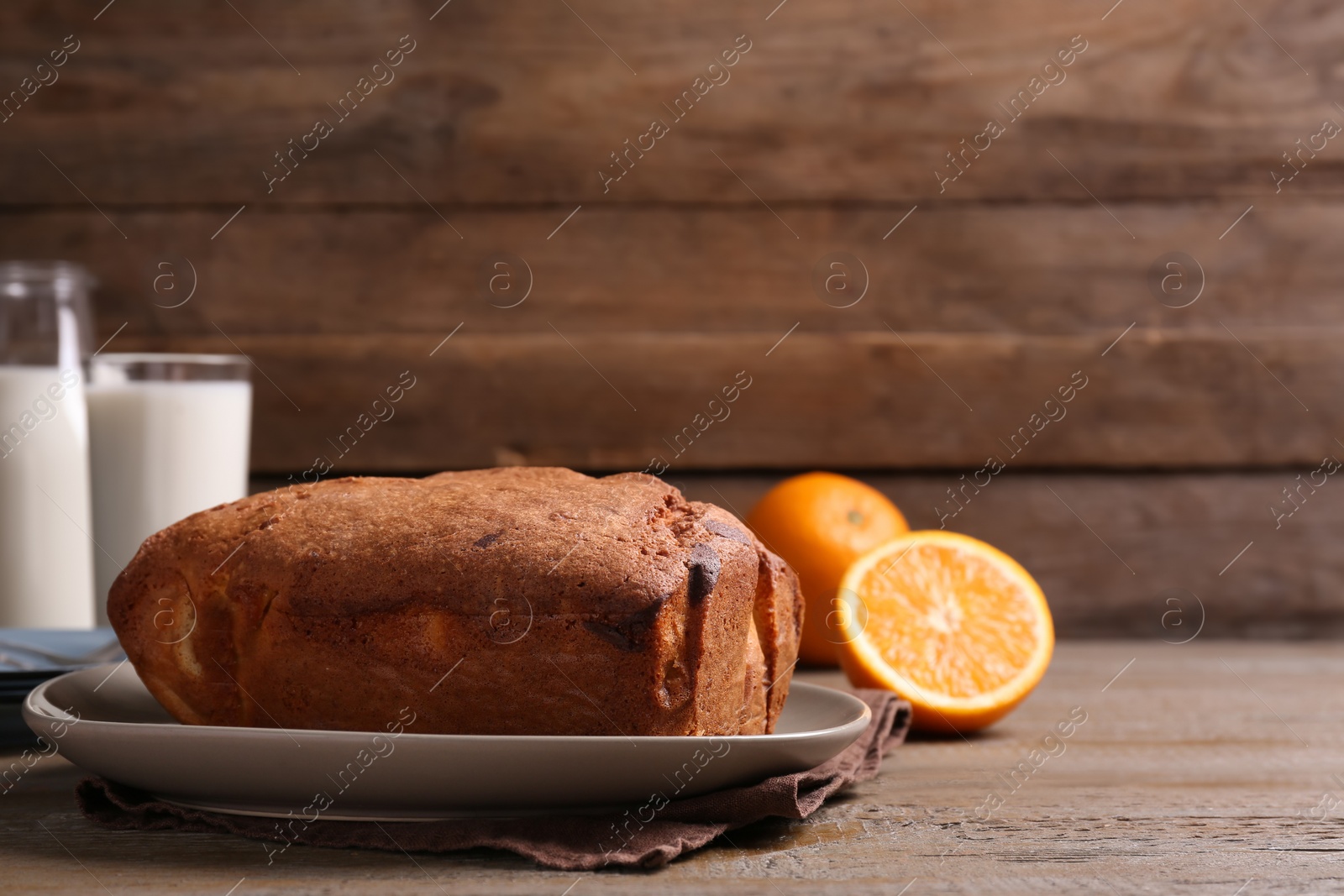 Photo of Fresh delicious cake served on wooden table. Space for text