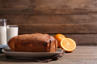 Photo of Fresh delicious cake served on wooden table. Space for text