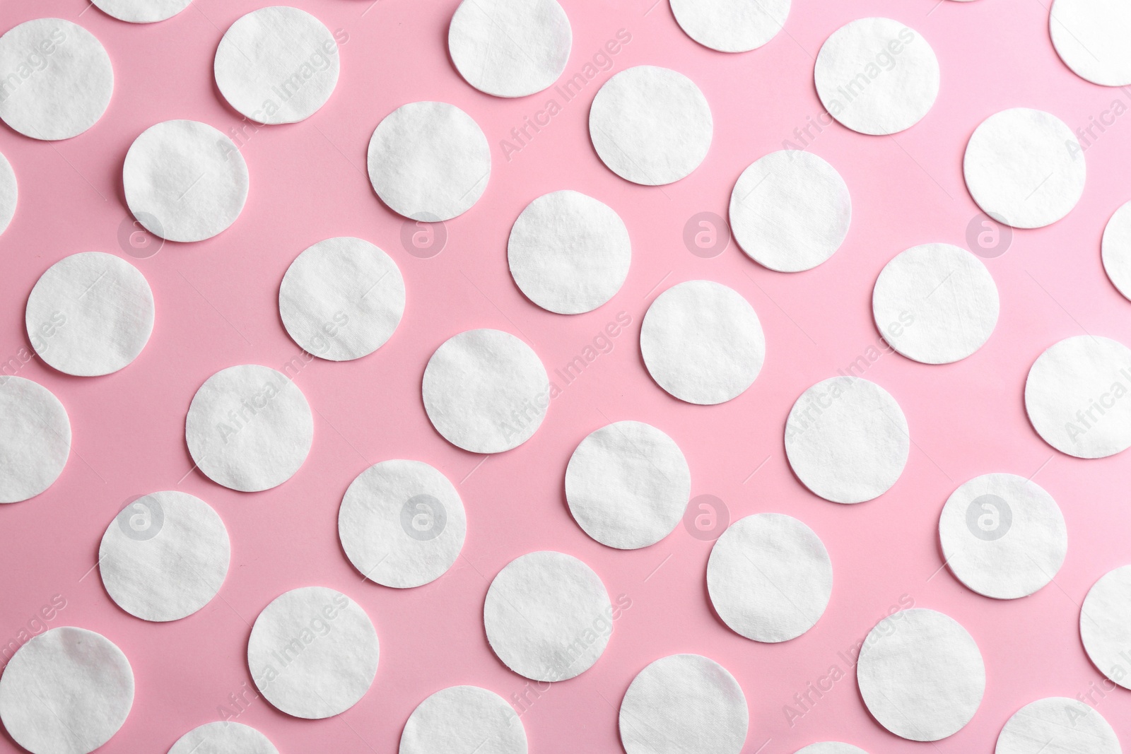 Photo of Flat lay composition with cotton pads on color background