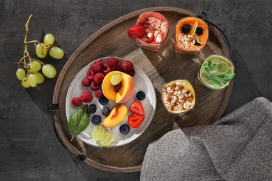 Many different delicious smoothies and ingredients on grey table, flat lay