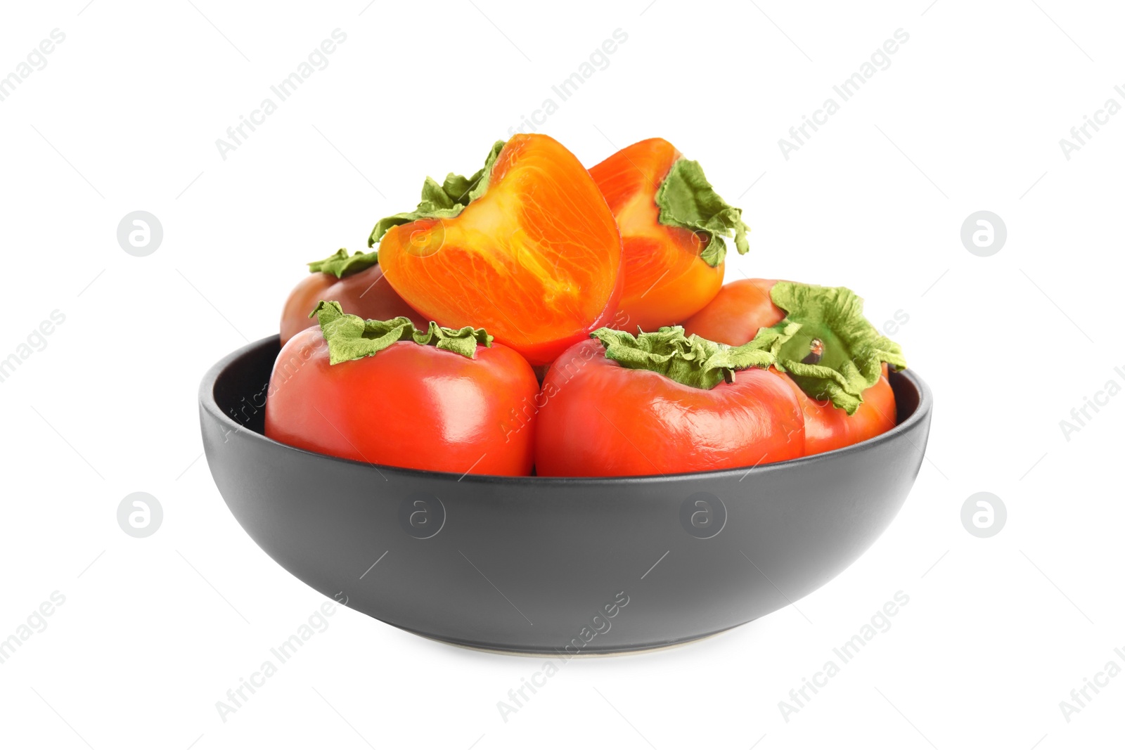 Photo of Bowl with delicious fresh persimmons isolated on white